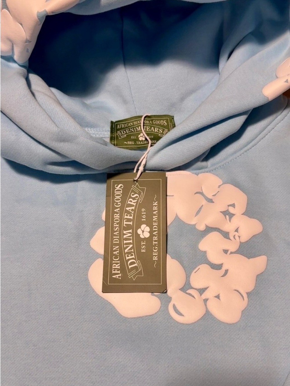 Denim Tears Men’s Light Blue Hoodie with Pink Floral Graphic